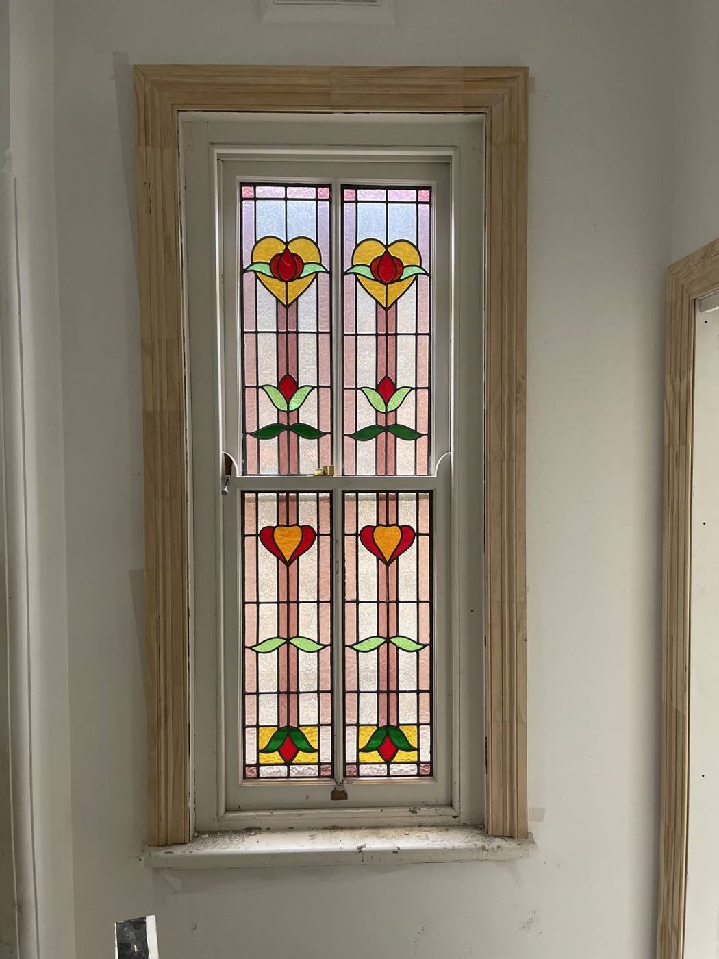 Restored leadlight window reset in a new timber frame and architrave, Inner West carpentry by Loel Homes